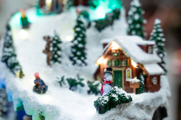 A beautifully crafted Christmas music box featuring reindeer, Santa figures, festive dolls, and a rotating carousel. The intricate design, warm lighting, and nostalgic holiday motifs create a magical 