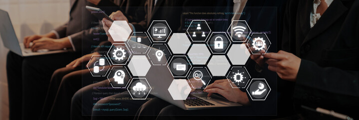 Professionals engage with technology in a contemporary setting, showcasing digital icons that represent innovation, security, and seamless connectivity in the corporate landscape. Trope