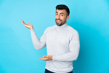 Caucasian man over isolated blue background extending hands to the side for inviting to come