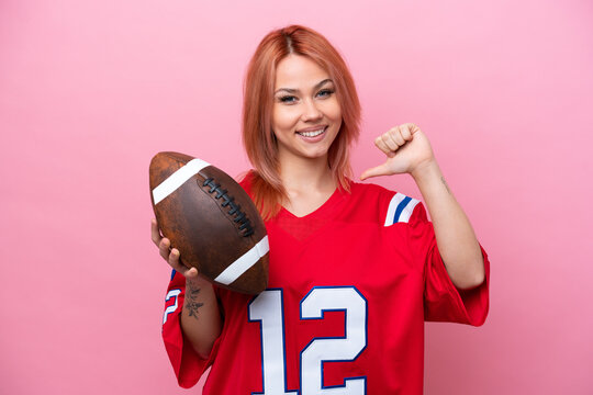 Young Russian girl playing rugby isolated on pink background proud and self-satisfied - Powered by Adobe