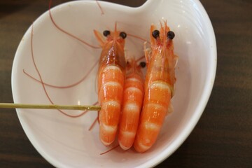 Three Shrimps on a Skewer in Dish