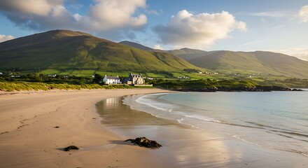 Serene coastal scene with sandy beach, rolling green hills, and a distant house under a cloudy sky