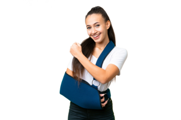 Young Arabian woman with broken arm and wearing a sling over isolated chroma key background celebrating a victory