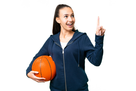 Young Arabian woman over isolated chroma key background playing basketball and having an idea - Powered by Adobe