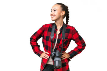 Young photographer Arab woman over isolated background posing with arms at hip and smiling