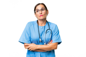 Middle-aged nurse woman over isolated background making doubts gesture while lifting the shoulders