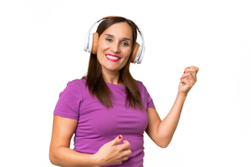 Middle-aged caucasian woman over isolated background listening music and doing guitar gesture