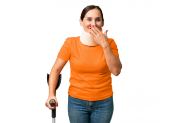 Middle-aged caucasian woman wearing neck brace over isolated background happy and smiling covering mouth with hand