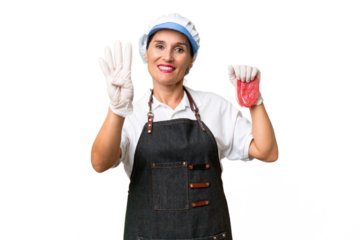 Butcher woman wearing an apron and serving fresh cut meat over isolated background happy and counting four with fingers