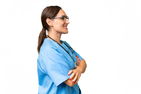 Middle-aged nurse woman over isolated background in lateral position - Powered by Adobe