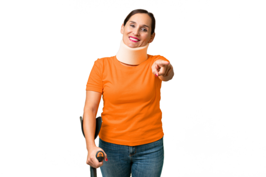 Middle-aged caucasian woman wearing neck brace over isolated background pointing front with happy expression - Powered by Adobe