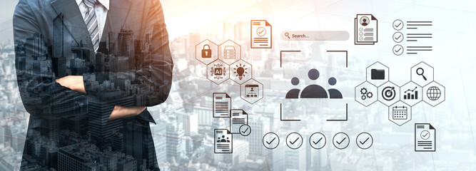 A businessman stands confidently with arms crossed against a backdrop of a city skyline, surrounded by digital icons depicting various data concepts, emphasizing modern technology. Gantry