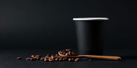 Dark Roast Coffee Beans and a Disposable Cup on a Black Surface