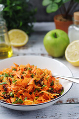 A bowl with traditional Polish carrot salad