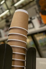 Stack of Kraft Paper Coffee Cups in Cafe Environment