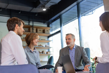 Group of happy progressive business people working on startup together at creative office