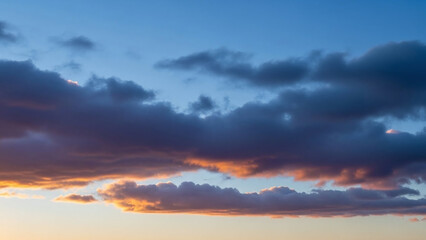 Fototapeta premium Dramatic Sunset Clouds with Orange Glow