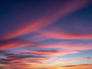 Fototapeta premium Streaky Pink Clouds in a Deep Blue Twilight Sky sunset