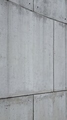 Concrete wall texture with vertical joint line, raw modern architecture surface, vertical 9:16 social media background