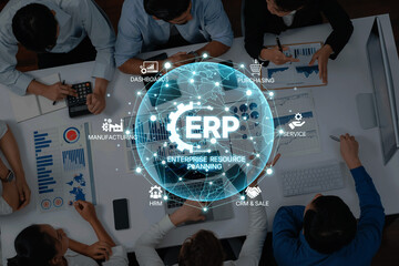 A diverse business team collaborates on enterprise resource planning, utilizing technology and data analysis to enhance decision-making and improve processes. Trope