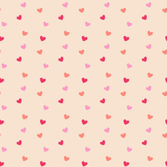 Flat vector seamless pattern of cascading small pink and red hearts on blush pink background. Romantic Valentine's raining hearts motif perfect for wrapping paper, textiles, wallpapers, invitations.