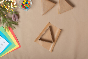 The triangles of the Advent calendar are made of thick cardboard. Step-by-step instructions. Step 6 Glue the triangle with paper