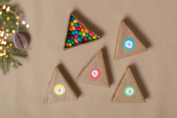 The triangles of the Advent calendar are made of thick cardboard. Step-by-step instructions. Step 7 Put the treats down