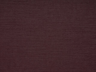 A detailed view of a maroon paper texture that exudes warmth with its deep, earthy tones and inviting tactile quality