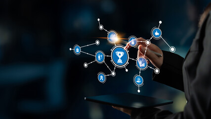 This image showcases a person interacting with a digital interface, illustrating concepts of achievement and success through data visualization and connectivity. Tessel