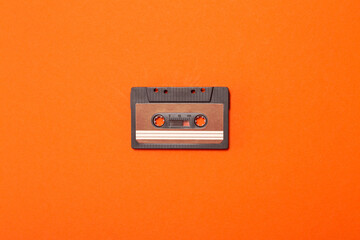 audio cassette on an orange background