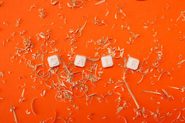 Sale sign on a orange background with sawdust