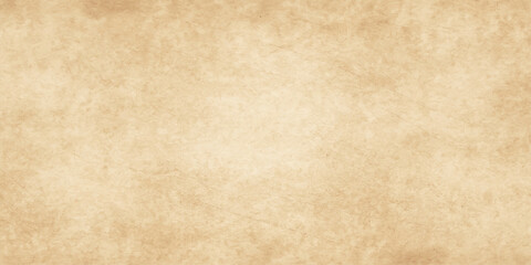 A textured, antique brown parchment sheet with a vintage, aged, and slightly burned grunge pattern. Aged brown parchment texture backdrop for vintage grunge design. vintage brown surface with stained