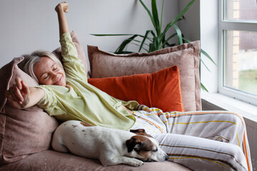 Attractive Woman relaxing on a comfy couch with eyes closed