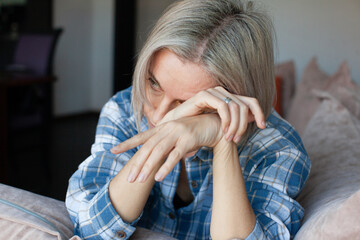 Close up of sad pensive Woman sit Alone thinking about relationships personal problems, upset thoughtful female indoor