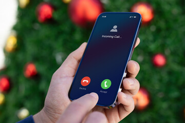 man hands  hold phone with incoming call on screen