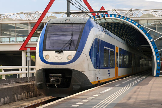 SLT local  train along platform at Amsterdam Duivendrecht station