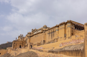 Fototapeta premium Architecture view of amber fort or amer fort palace of jaipur. Amber fort is a famous tourist destination of rajasthan. Tourists from entire world travel to amber fort and witness the palace.