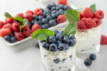 Curd dessert with berries and mint.