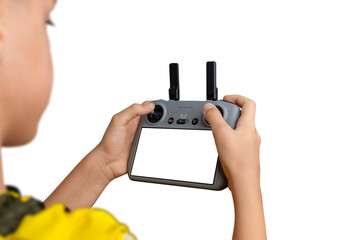 Boy holding a drone controller with blank screen, perfect for inserting custom UI, drone app designs, or technology mockup presentations