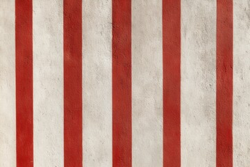 Fototapeta premium Textured wall featuring alternating red and white vertical stripes, creating a striking visual contrast that enhances the ambiance of any space with a bold design element