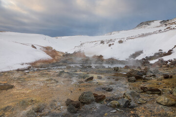 Steaming geothermal pools in snowy Seltun Krysuvik Iceland, Iceland.