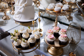 Elegant dessert table with decorated cupcakes and sweets for a special celebration