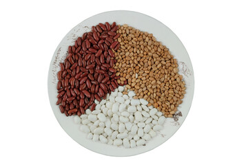 Top view. Variety of beans in plate on white background. Vegetable protein and plant-based diet. Vegetarian cuisine. Food background.