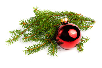 Red Christmas tree ball and spruce branch on a white background