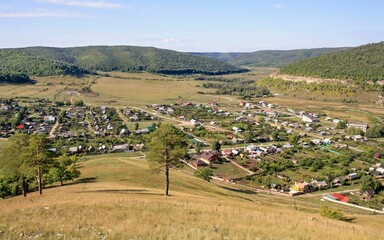 old russian village shiryaevo on the bank of the river volga zhigulevskie mountains on a summer day