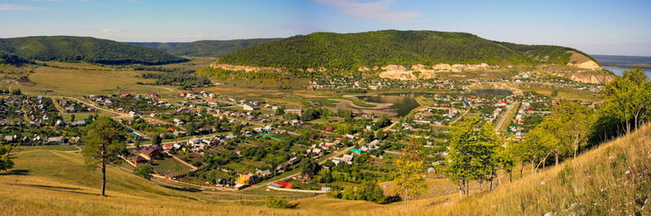 old russian village shiryaevo on the bank of the river volga zhigulevskie mountains on a summer day