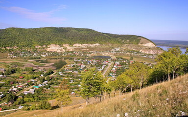 old russian village shiryaevo on the bank of the river volga zhigulevskie mountains on a summer day