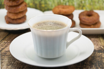 Coffee and Donuts on a Rustic Wooden Table