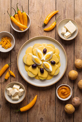 Fototapeta premium Papa a la huancaína, a delicious Peruvian dish with boiled potatoes, egg, and olives. Traditional food