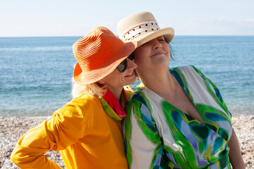 two women same sex couple on seaside having vacation, lifestyle people concept